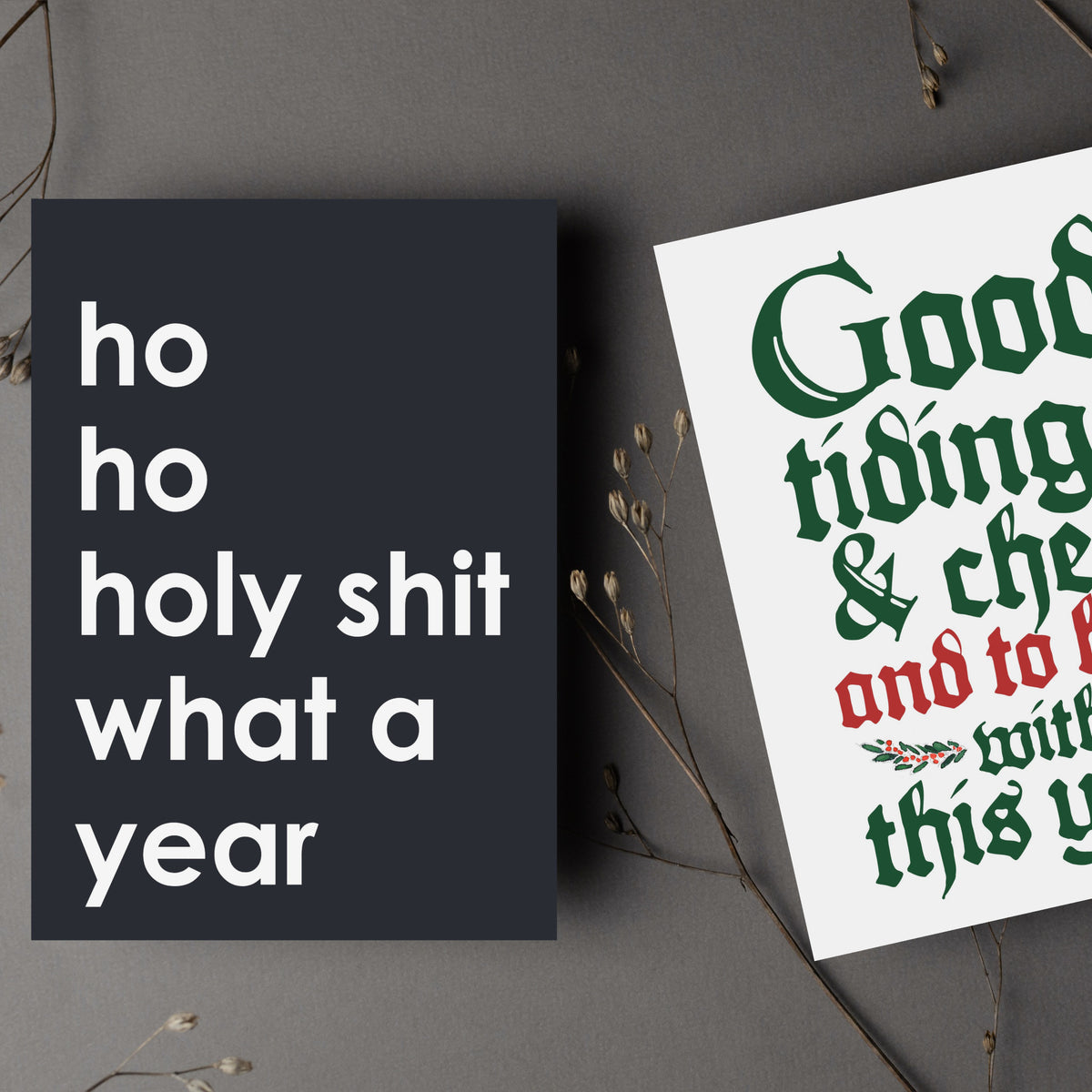 Christmas cards featuring illustrated motifs including a cartoon child, gnome, T-rex, and tangled lights.