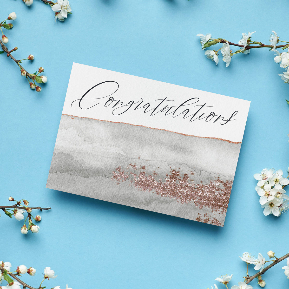 Greeting card set with minimalist watercolor-style design, centered script lettering, and rose gold and copper color palette.