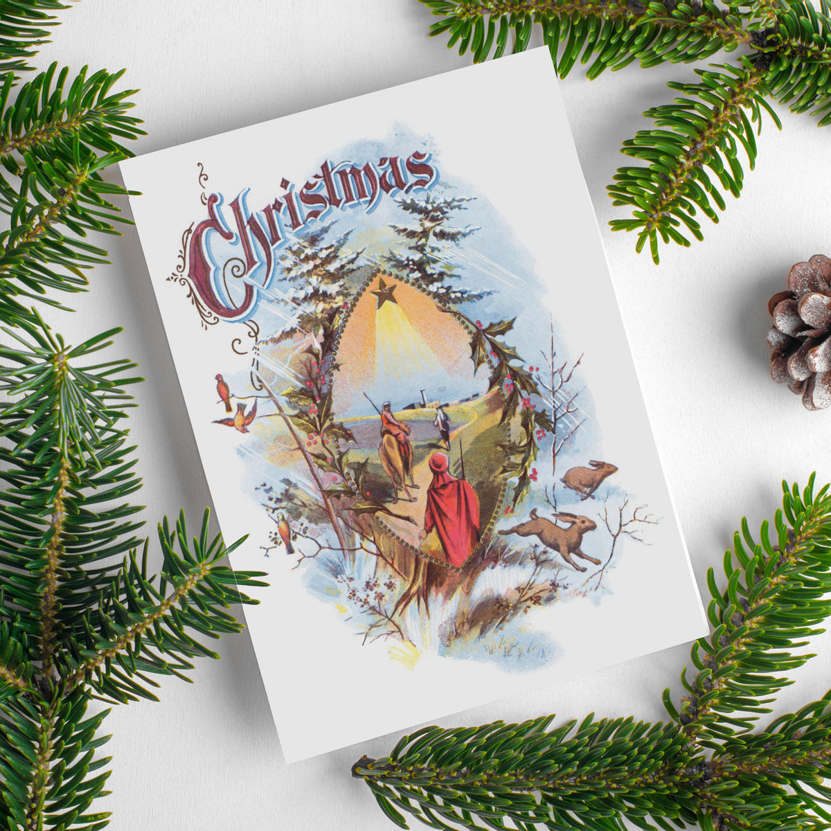 White Christmas card with pale blue wash vignette, fir trees, orange songbirds, leaping hares, and three wise men.