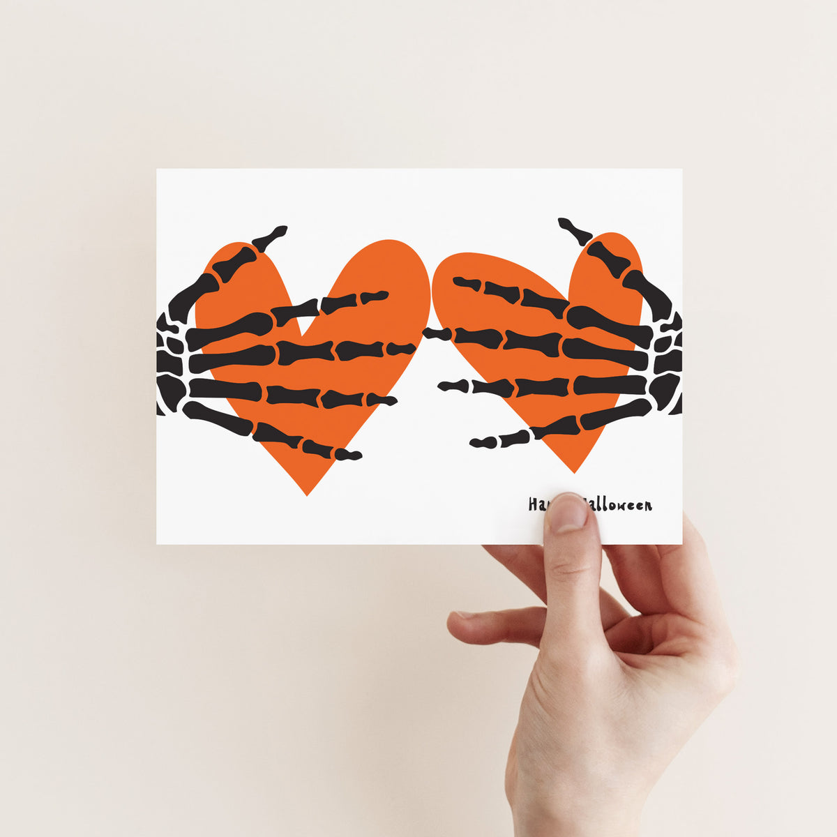 Single-design card set depicting two skeleton hands with segmented finger bones spread across orange hearts.
