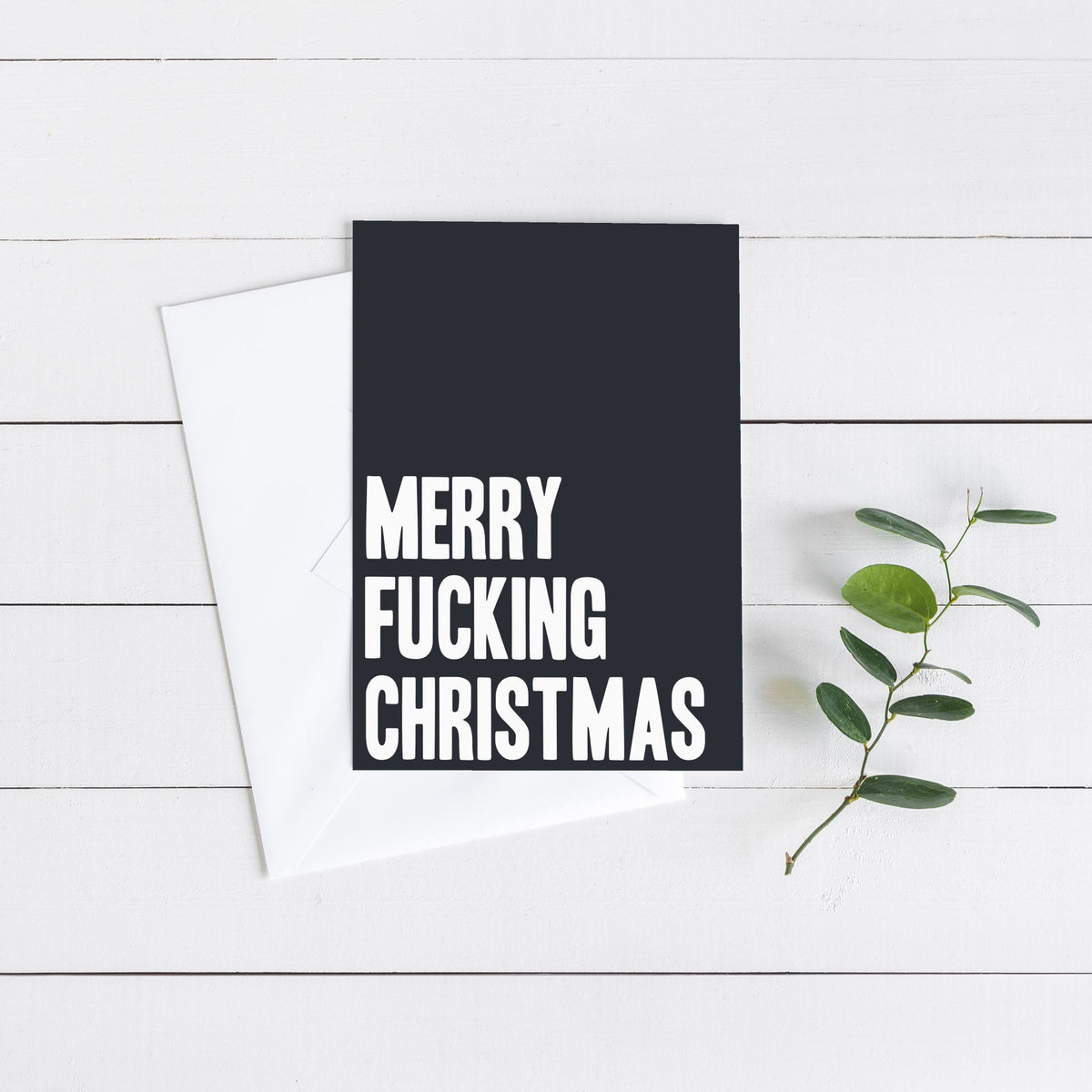 Christmas cards with centered text in bold block caps or cursive script, printed on black or white card faces, pack of 24.