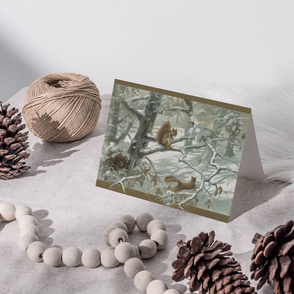 Card set showing snow-covered woodland scenes with squirrels, owls, blue jays, and perching birds.