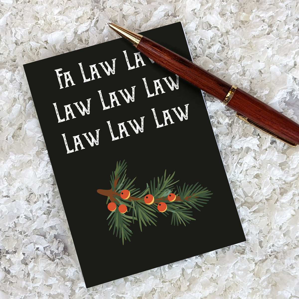Two-design card set; both designs feature matching pine branch illustrations and stacked slab-serif text in contrasting color