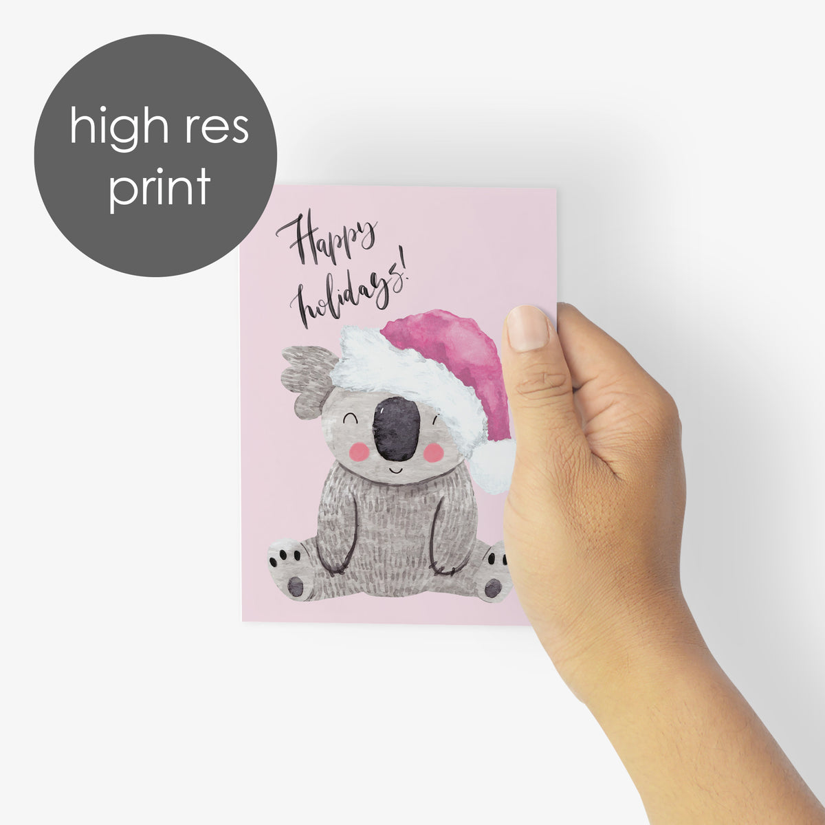 Pink-toned holiday card pack with designs including a peace-sign wreath, disco ball rainbow, and pink Christmas tree.