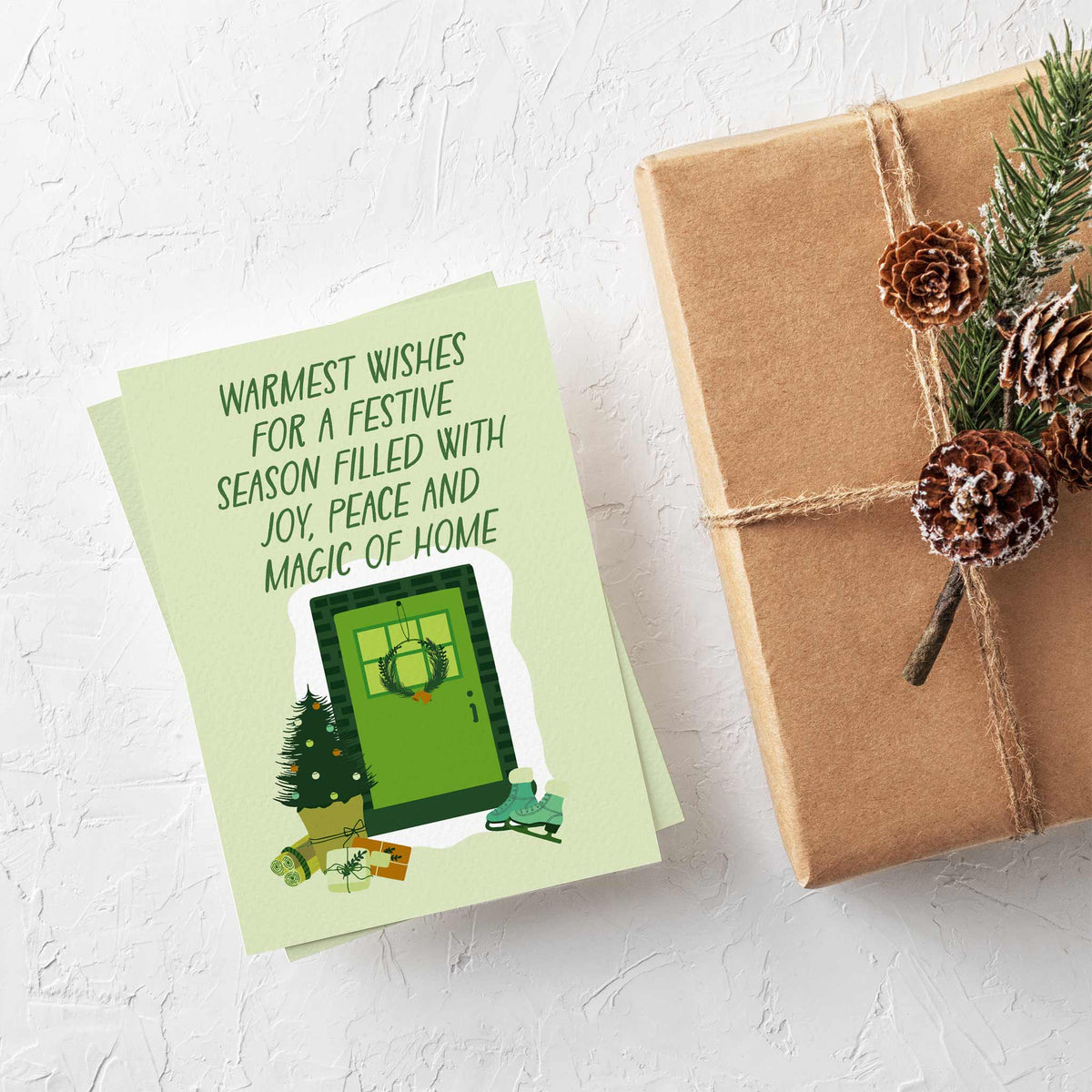Flat illustrated Christmas cards with new homeowner sentiments in hand-drawn all-caps dark green lettering.