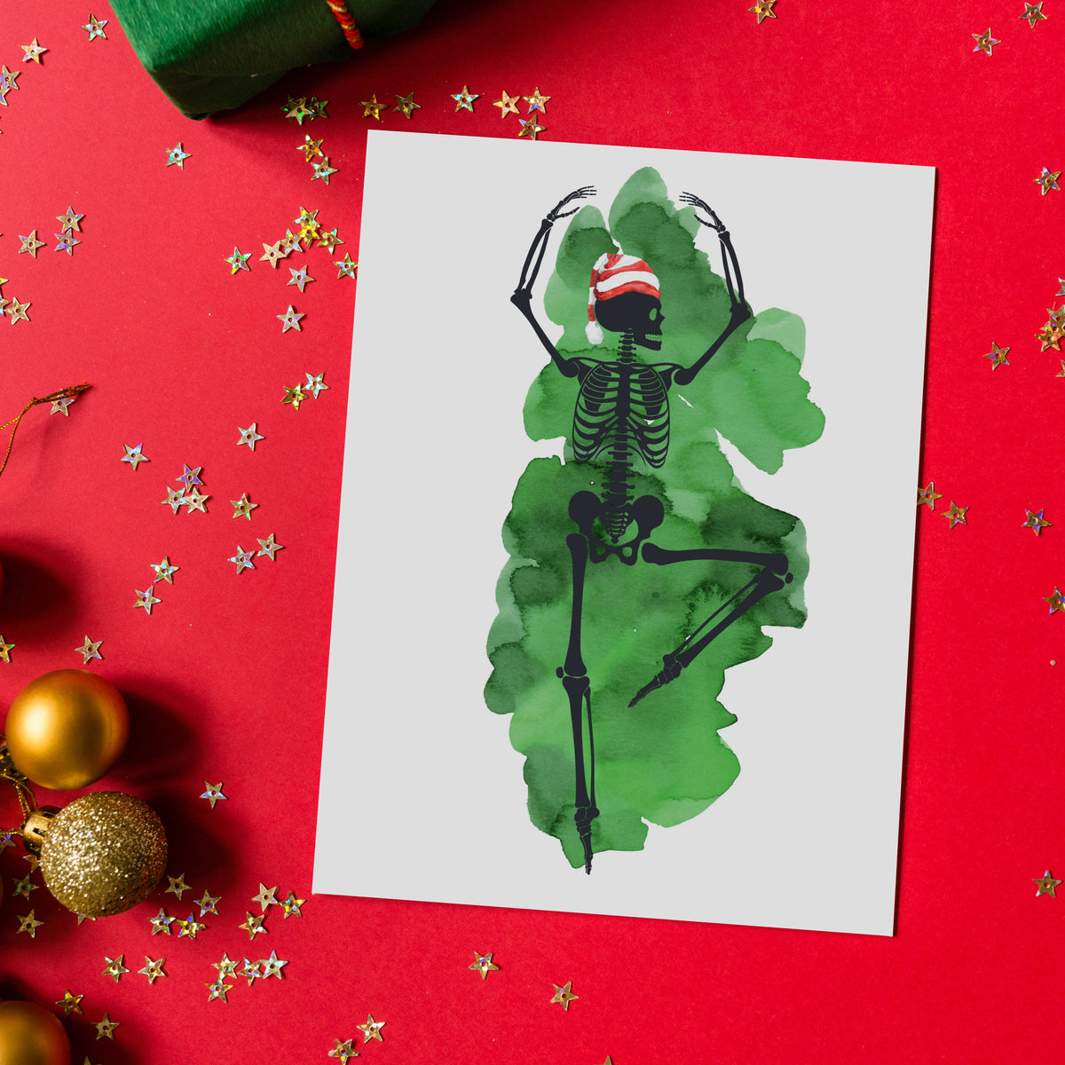 Card boxed set, 4 cards per design, skeleton figures in ballet stretches over magenta, green, red, and orange splashes.