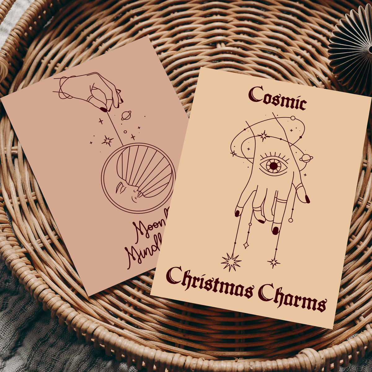 Mystical holiday notecards featuring celestial illustrations and uppercase and script typography on muted vintage-inspired ba