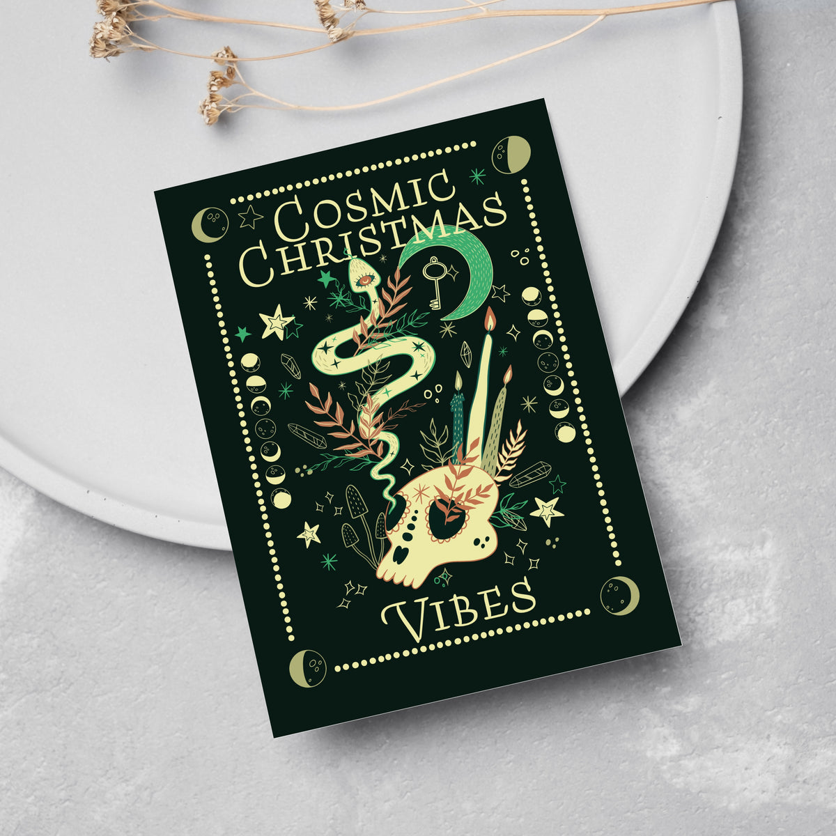 Set of 24 cards in four designs: cosmic skull, witchy hands, hourglass, and horned mask motifs on forest green.