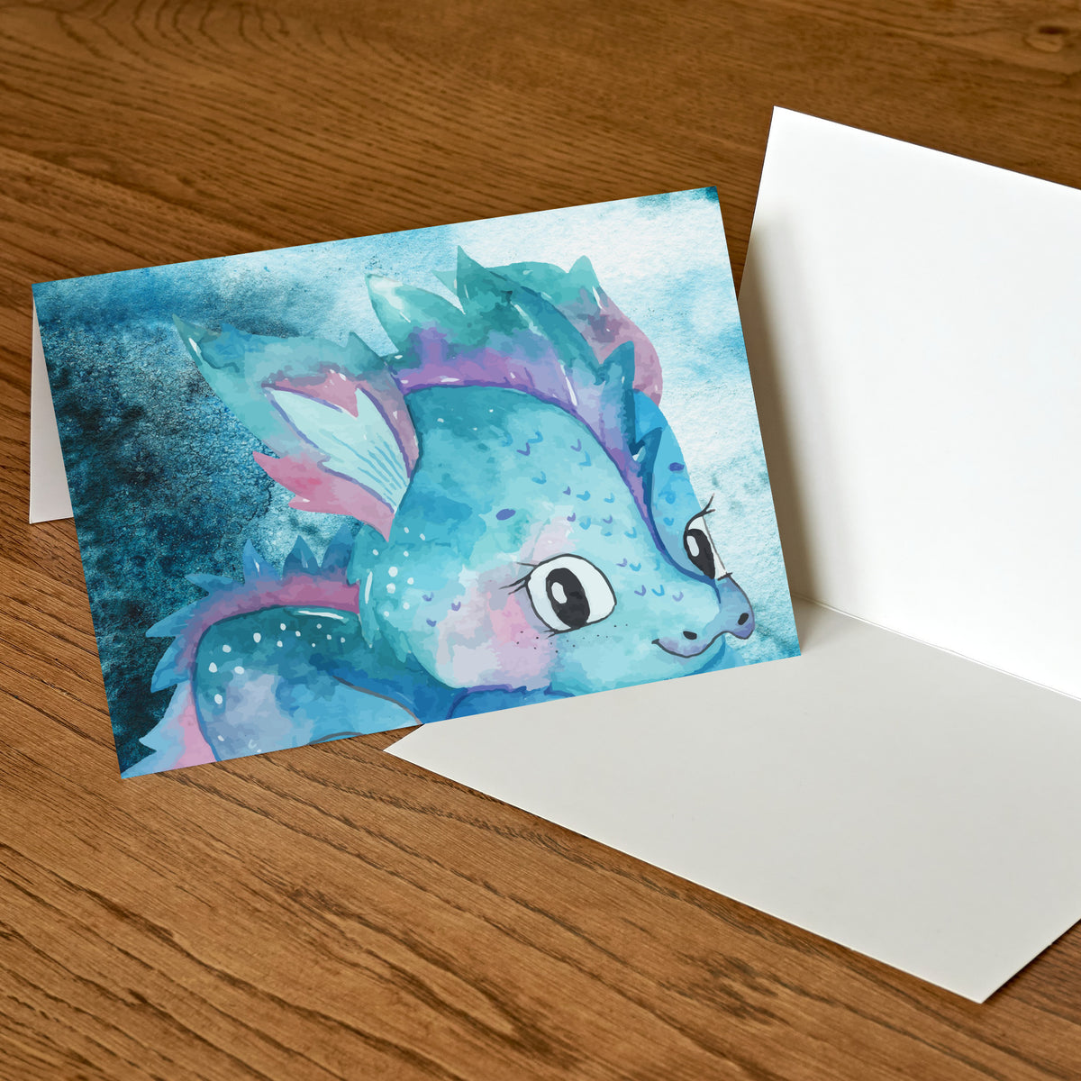 Greeting card set of 24 featuring distinct watercolor-style dragon designs with playful, hand-drawn character illustrations.