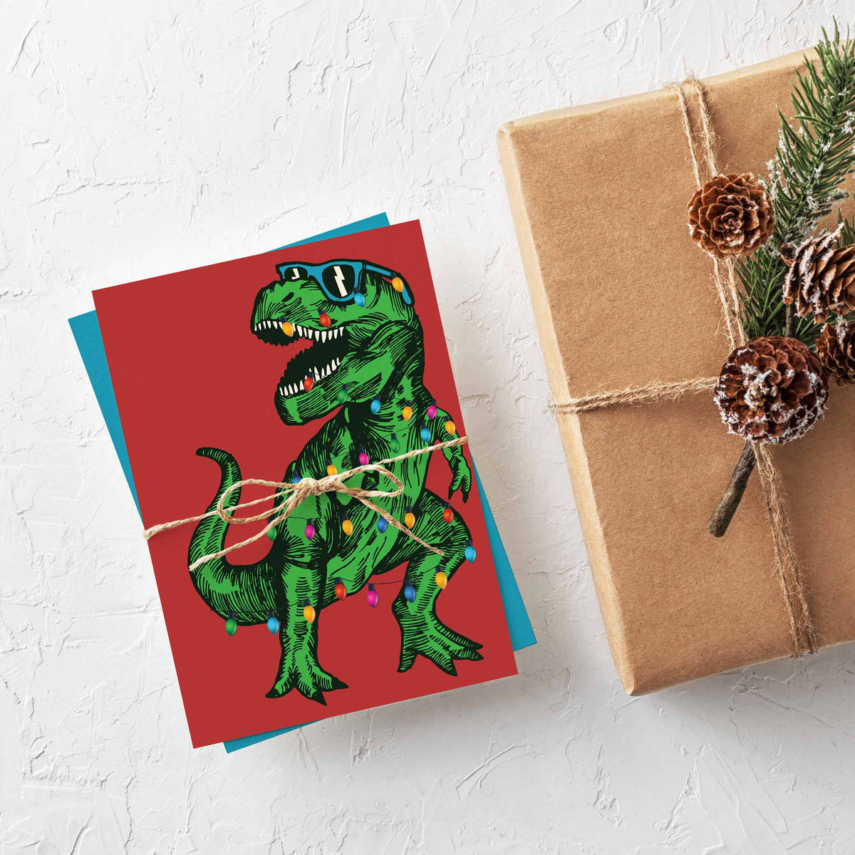 Card set with a hatched dinosaur illustration on solid teal and solid red backgrounds, 12 of each design.