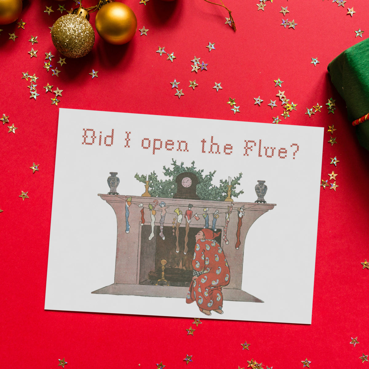 Fireplace mantel with clock, green garland, candlesticks, and stuffed stockings in striped and solid patterns.