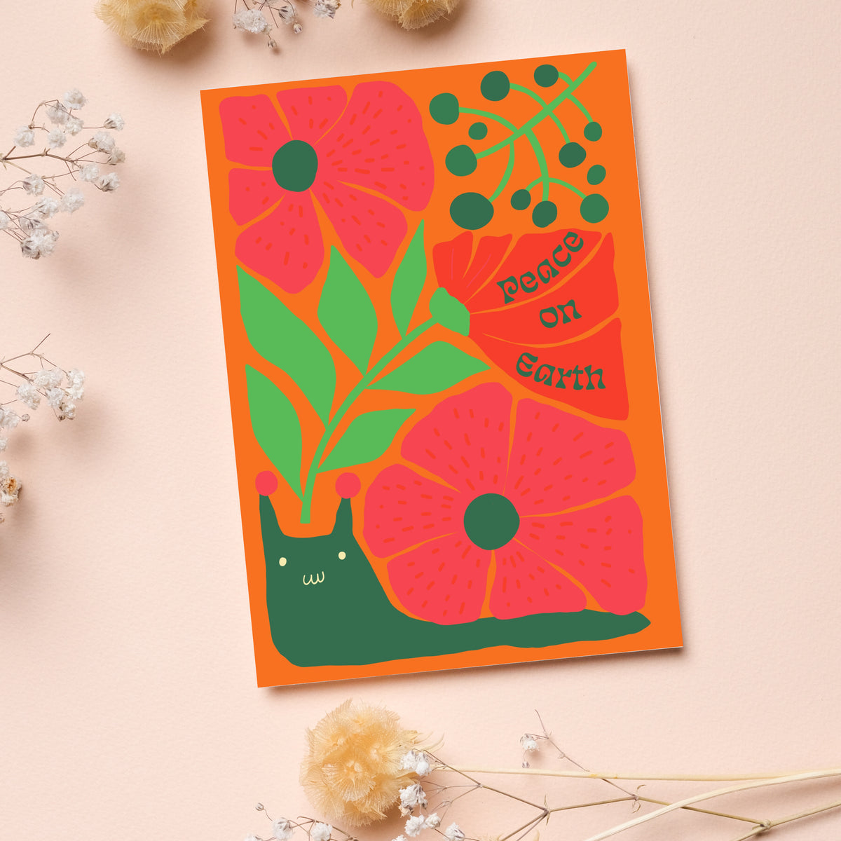 Six Christmas card designs with holiday phrases set inside leaf and petal shapes in flared serif lettering.