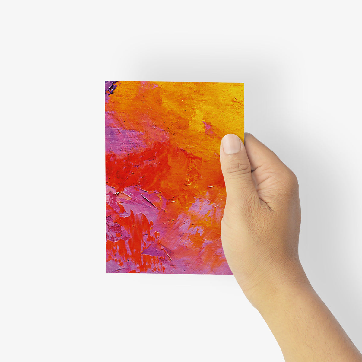 Notecards with painterly marbled patterns in orange, pink, yellow, purple, and gold.