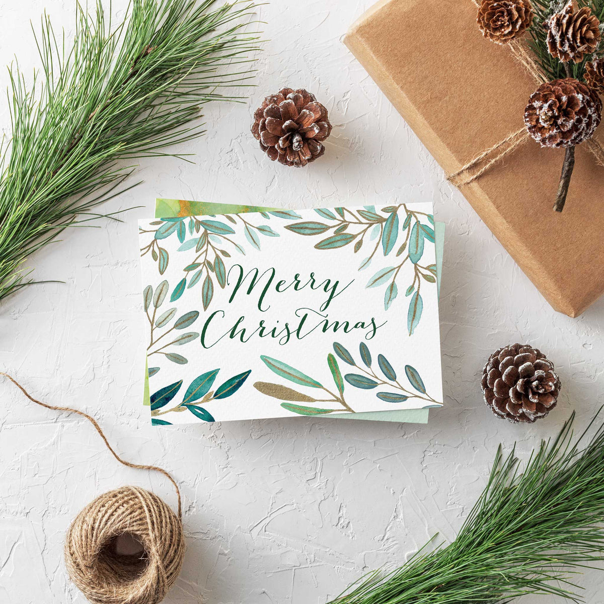 Eight holiday card designs with green leaf wreaths, branch borders, and gold dot accents on white backgrounds.