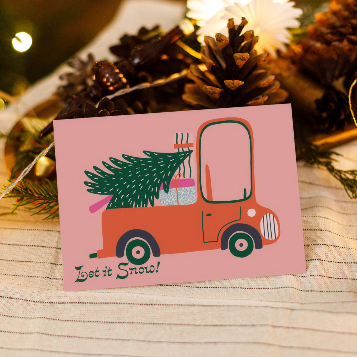 Holiday card set of 24 with retro-style vehicle illustrations and dark green curved script lettering.
