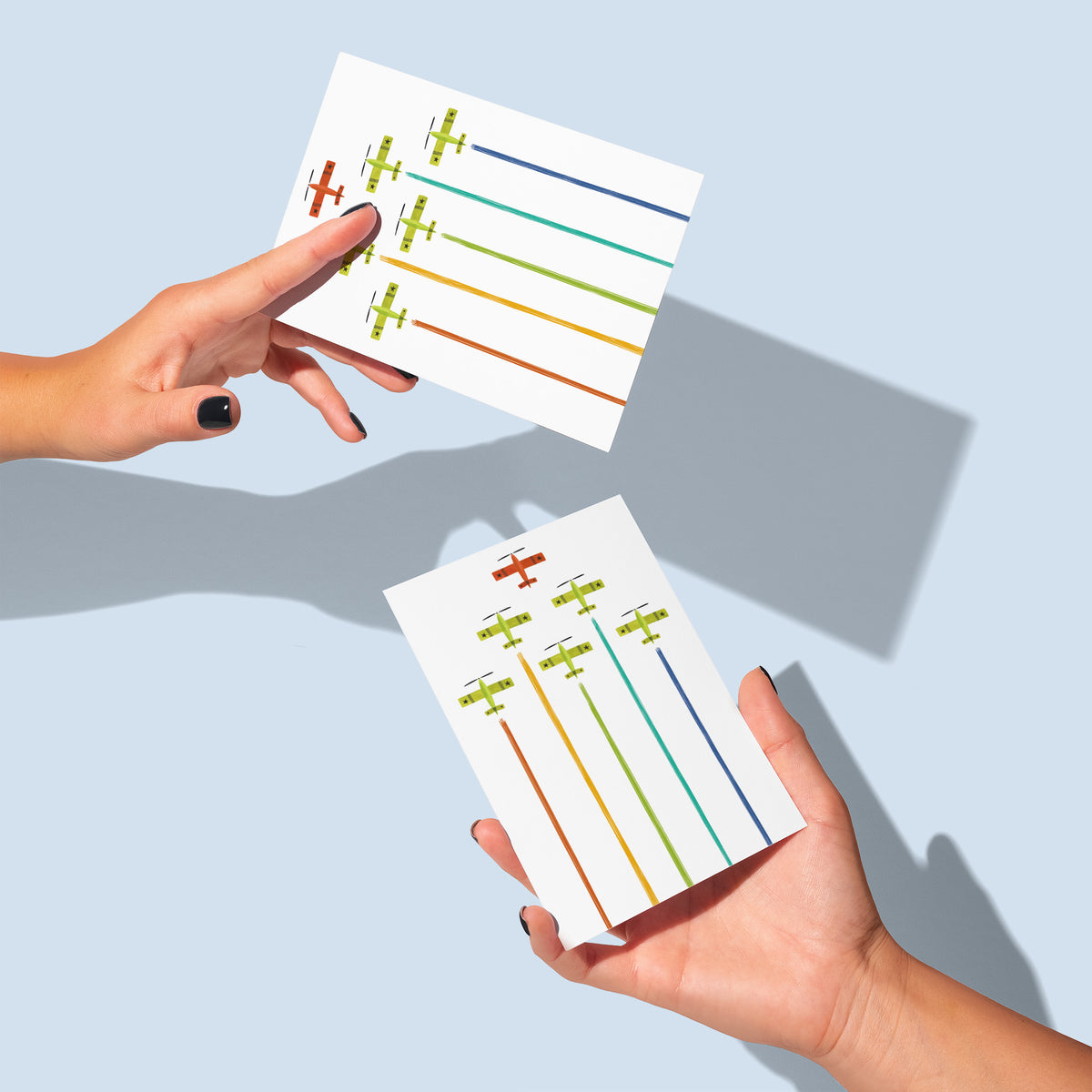Airshow formation card design with six planes and smoke streams in orange, yellow, green, teal, and blue.