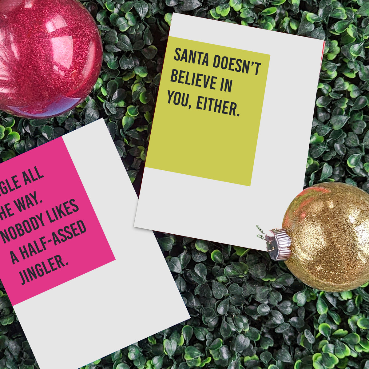 Christmas card set with phrases including "Santa doesn't believe in you, either" and other sarcastic one-liners.
