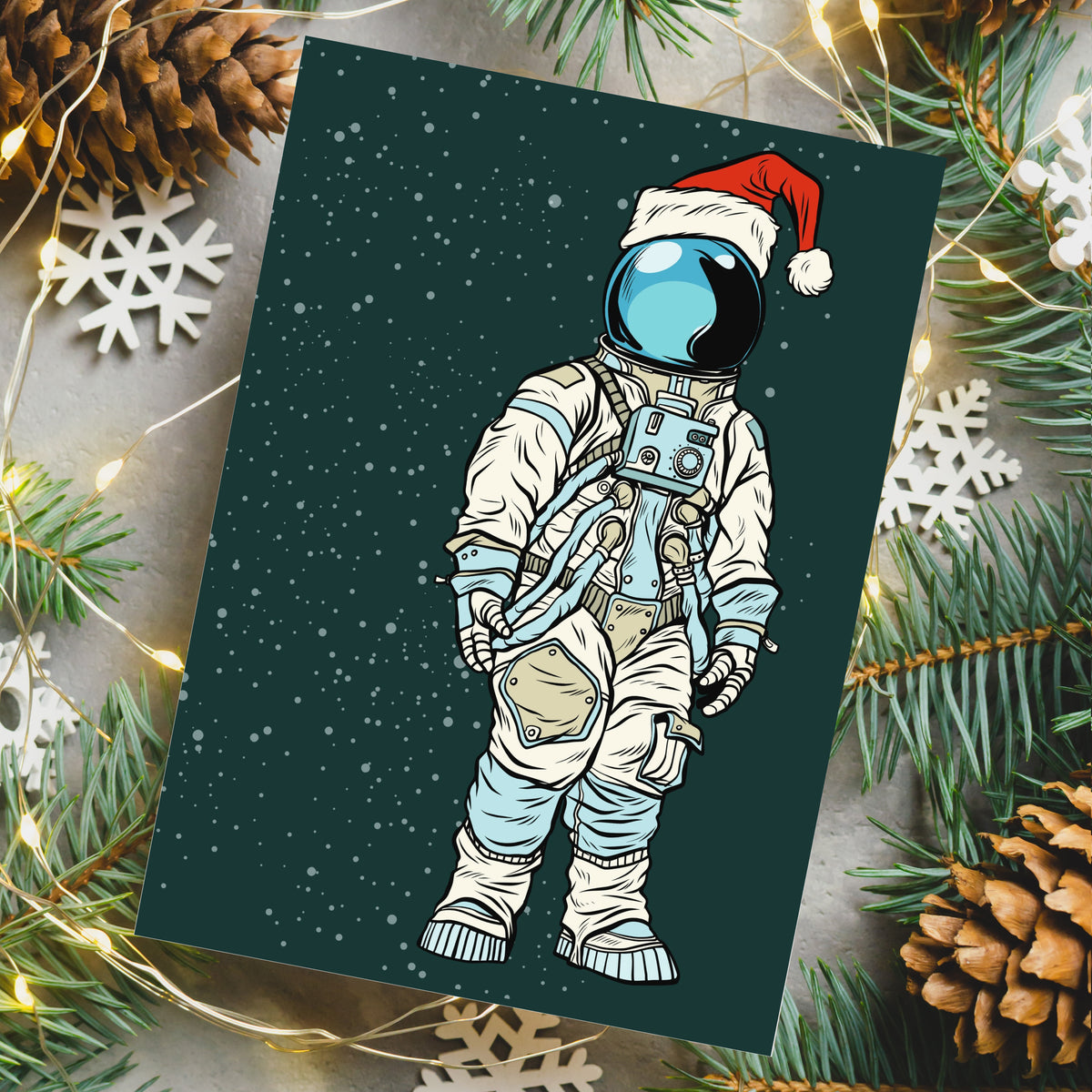 Set of 24 portrait-orientation holiday cards depicting a suited astronaut with Santa hat and blue visor.