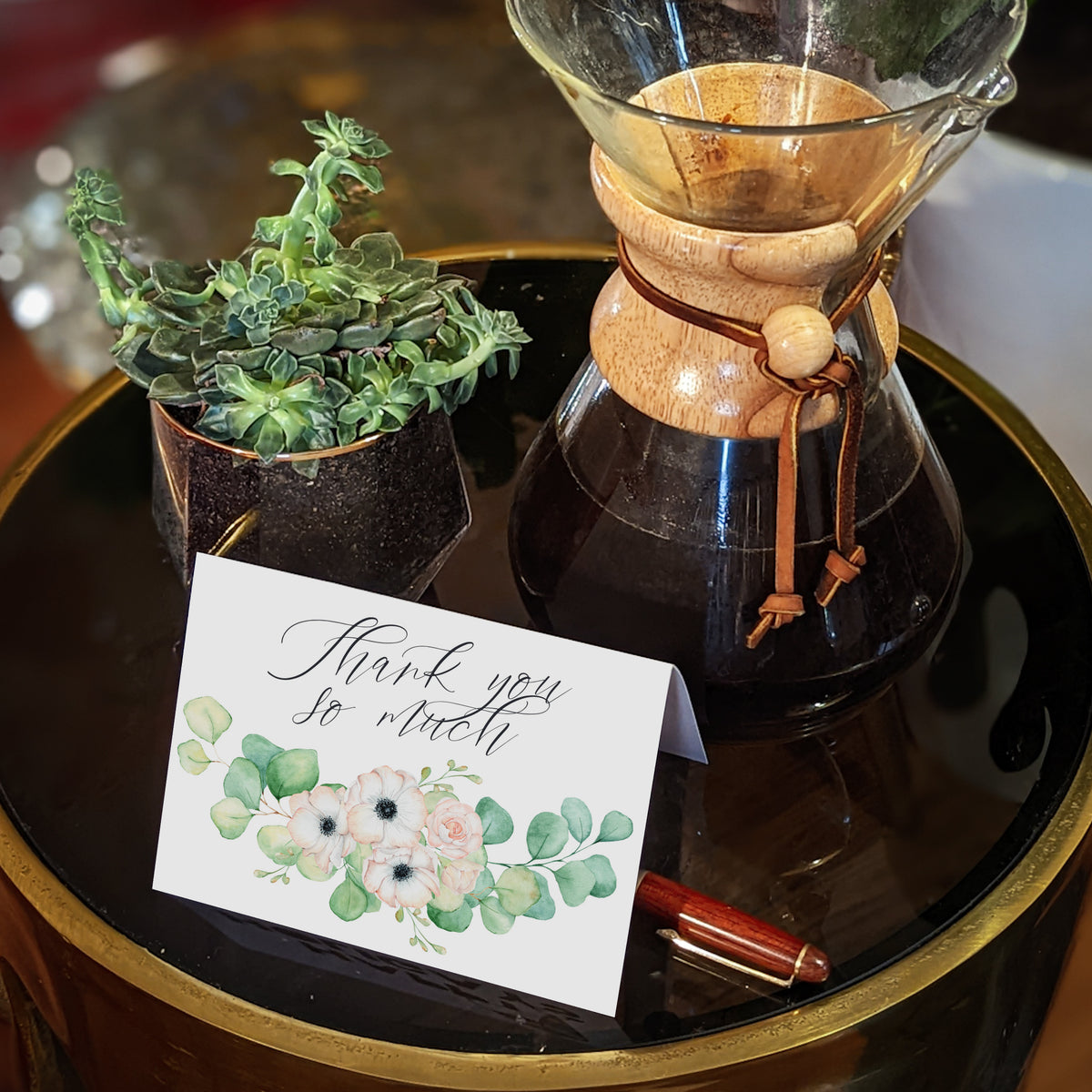 Thank you cards with flowing script and soft green and blush watercolor botanicals.