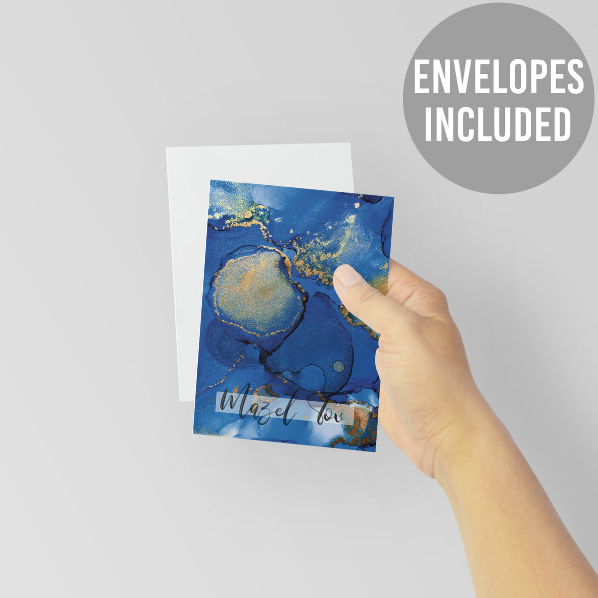 Card boxed set, single abstract design, navy and blue tones with gold speckles and script text.