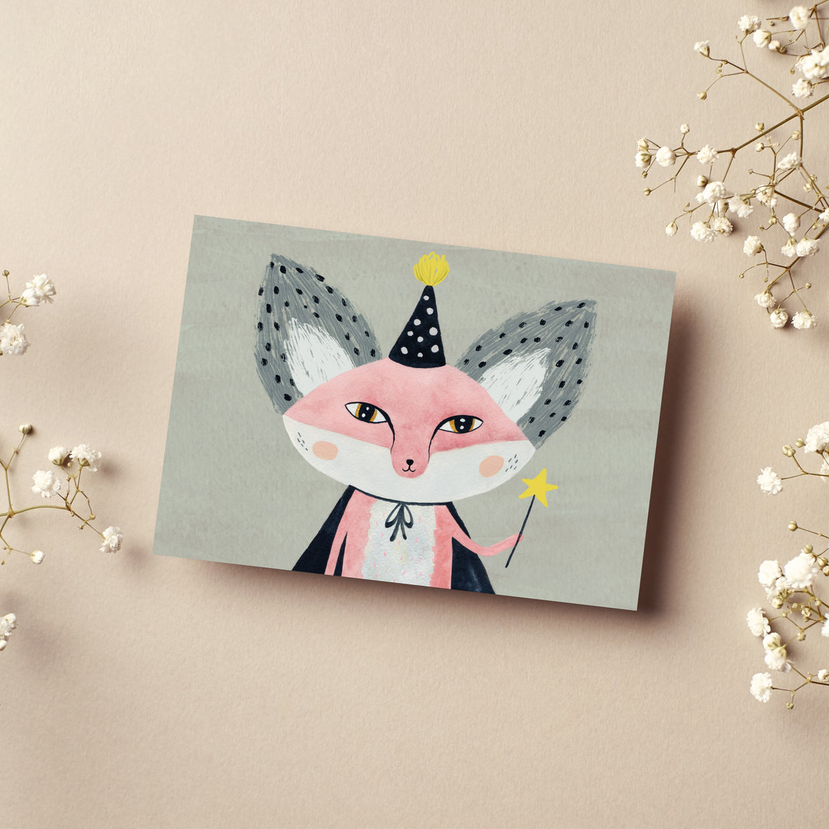 Party cards depicting a front-facing fox with pink cheeks, a navy wizard hat, and a yellow five-pointed star wand.