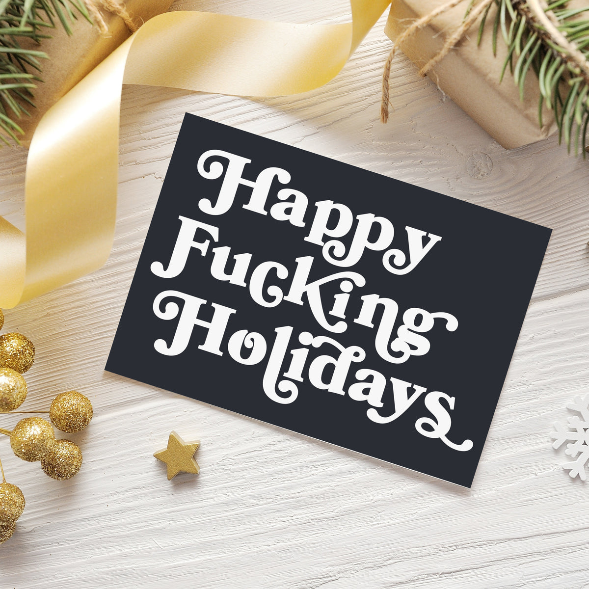 Charcoal Christmas cards with full-bleed backgrounds and three-line left-aligned white lettering, 24 cards total.
