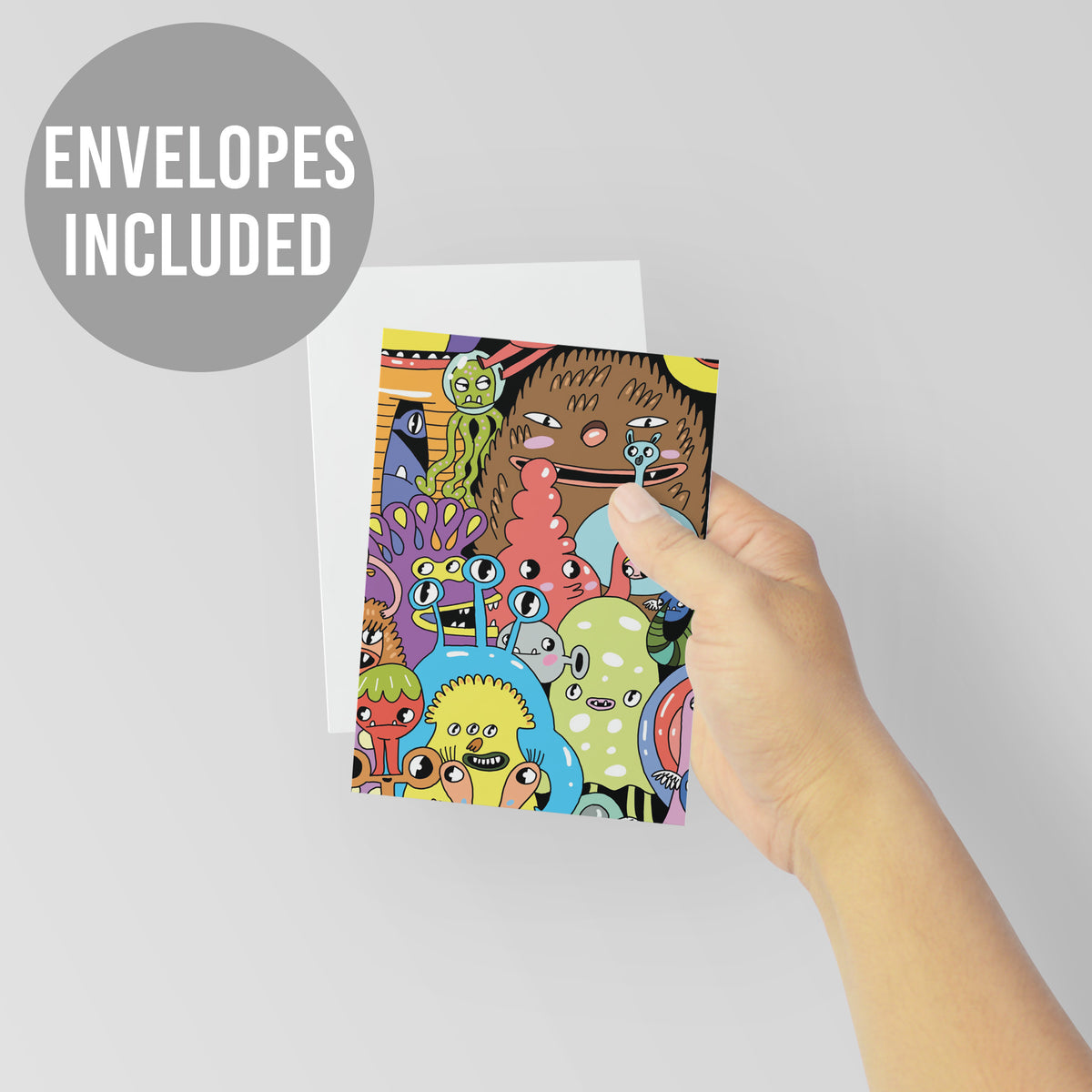 Quirky illustrated greeting card set of 24 featuring bright, character-filled cartoon monster artwork.