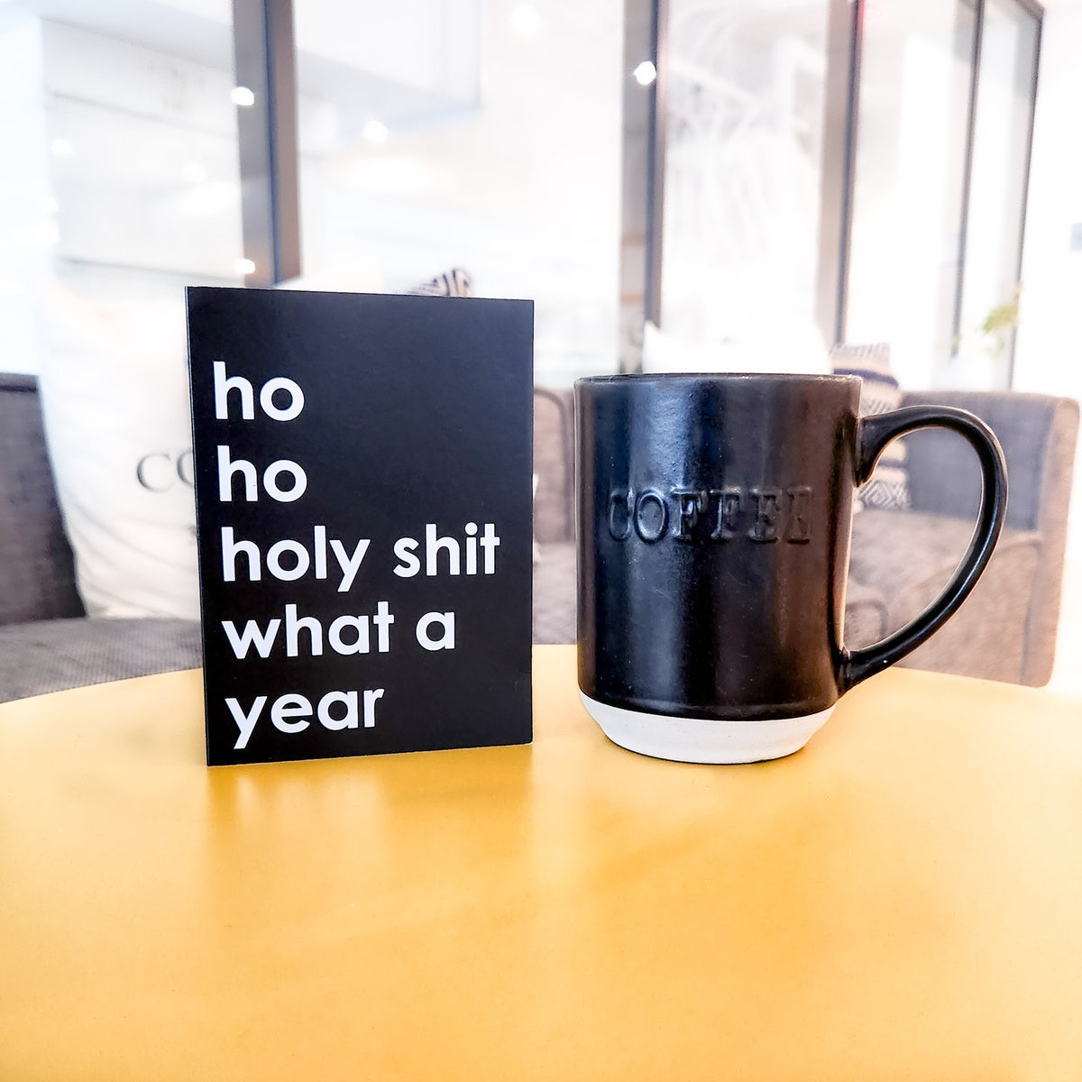 White cardstock holiday card reading "i heard you were naughty but that's none of my business" in bold black text.