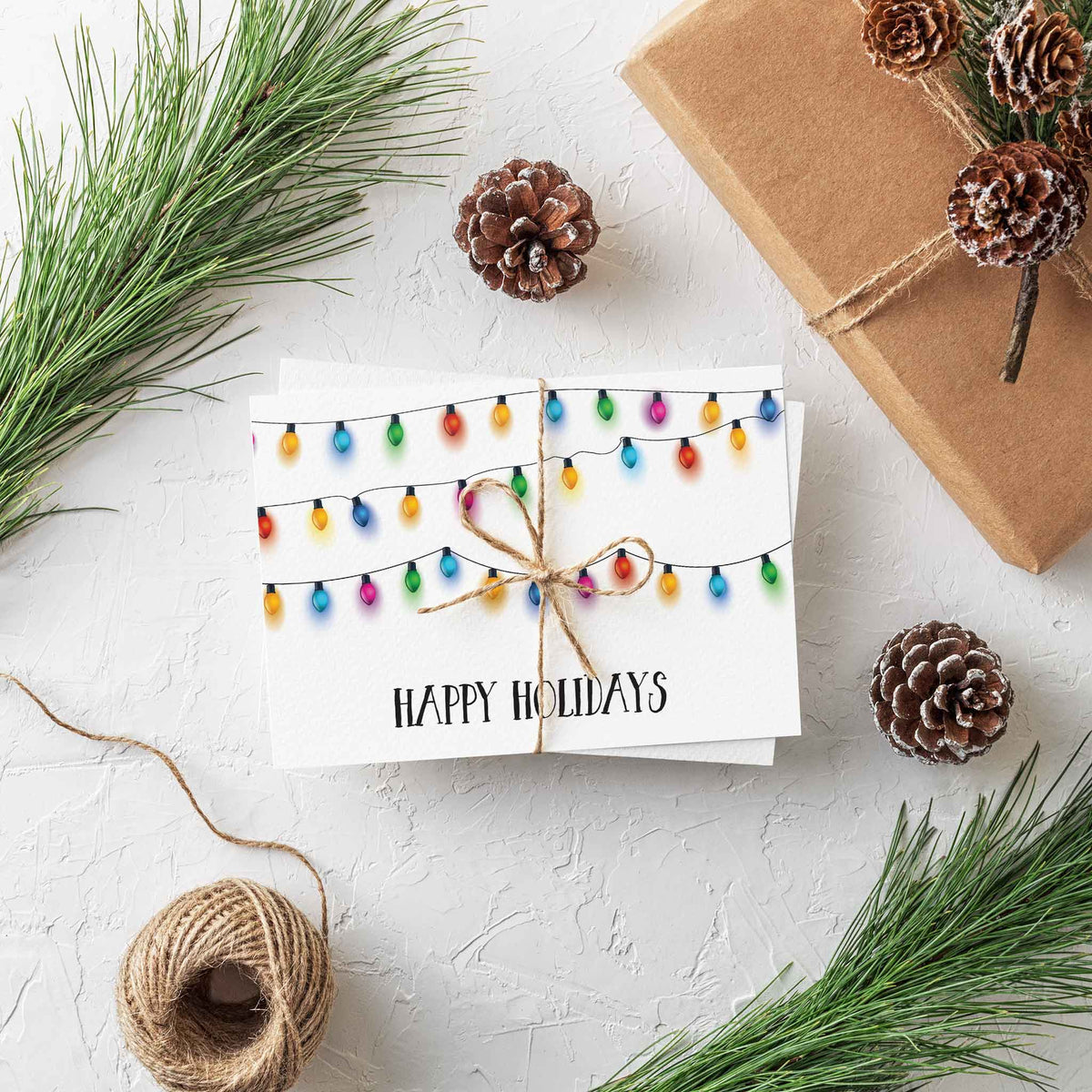 Bold brushy all-caps "HAPPY HOLIDAYS" text in near-black navy on a white landscape-format card.