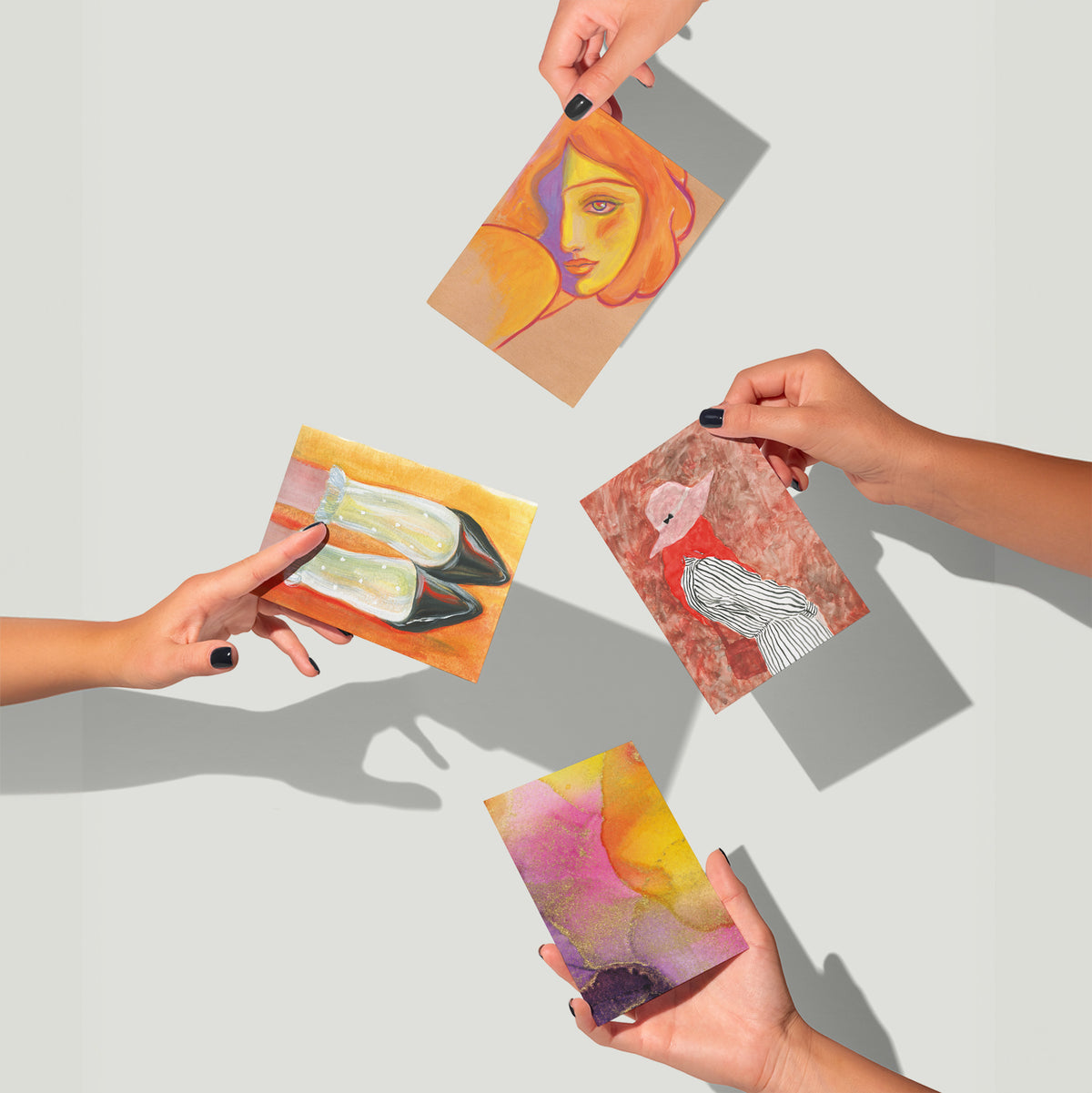 Stationery set of 24 cards with rotating abstract art designs including shoes, figures, and stylized portrait motifs.