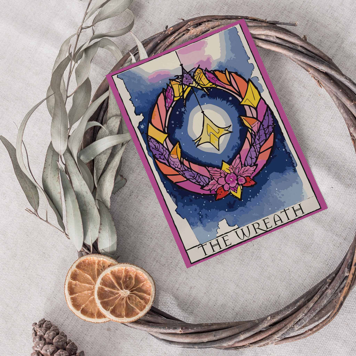 Holiday card set with tarot card structure: illustration panel above, black-ruled title box below, on each of 24 cards.