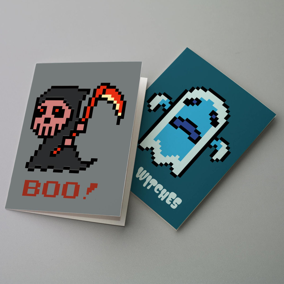 Halloween notecard set featuring a pixel ghost, grim reaper, vampire, and bat character across 4 card designs.