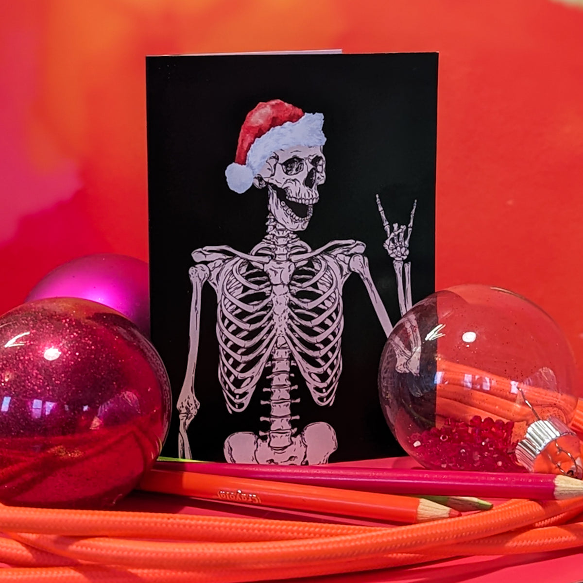 Holiday cards with full skeletal line-art illustration including visible ribcage, spine, and skull details.