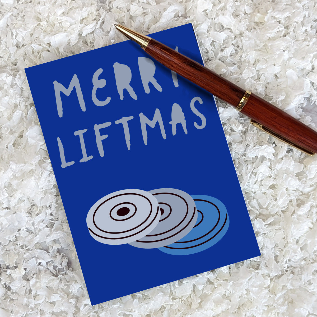 Christmas cards across six designs: boxing gloves, hex dumbbells, barbell plates, kettlebell, weight plates, sneakers, and mo
