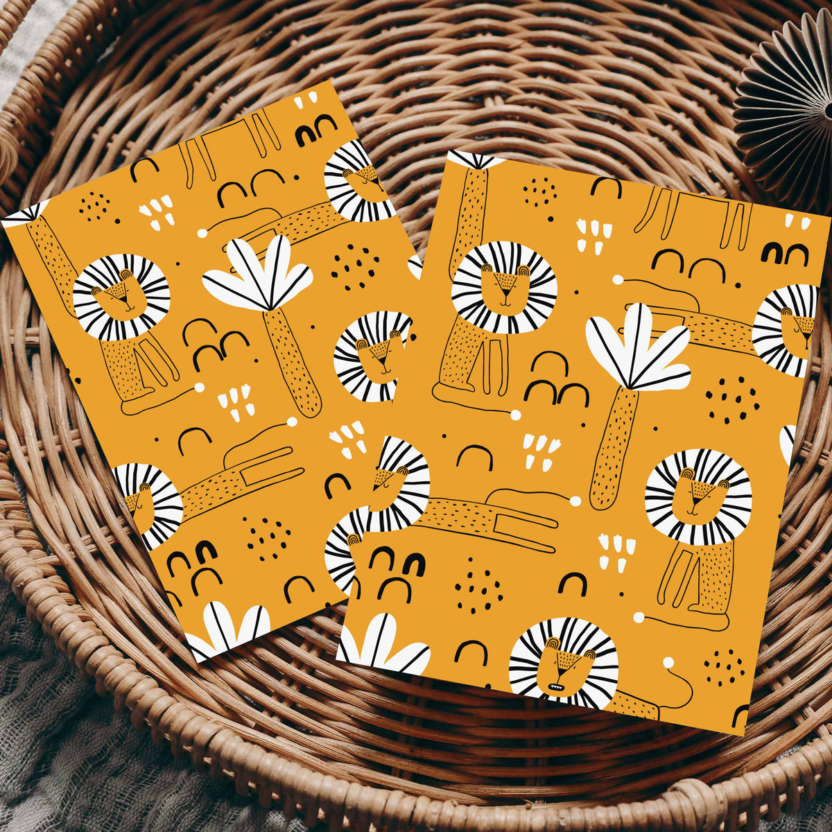 Greeting cards with illustrated lions featuring dot-patterned bodies, radiating manes, and scattered leaf accents.