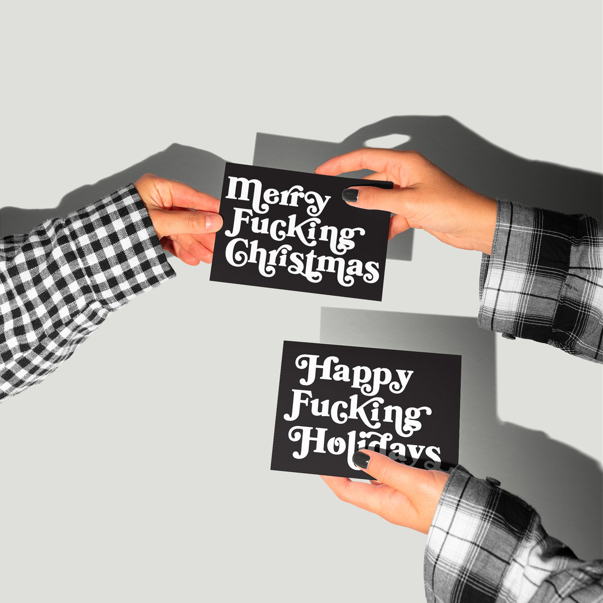 Mixed-case white swash serif text on near-black cards; two phrases, 12 cards per design, 24 cards per set.