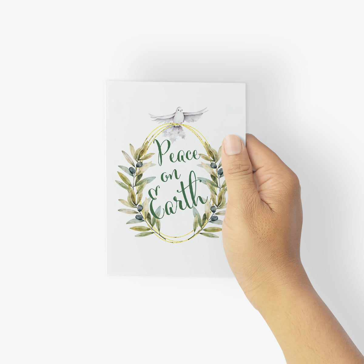 Folded holiday cards with watercolor and flat-illustration doves carrying olive branches and berry sprigs.