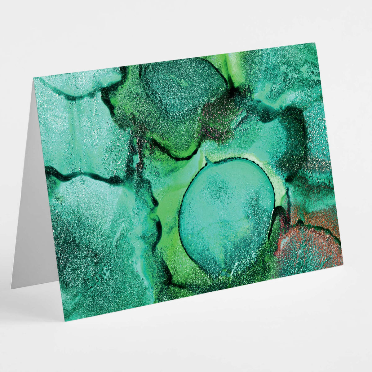 Abstract marbled stationery set of 24 cards in green, teal, and gold with swirling mineral patterns.