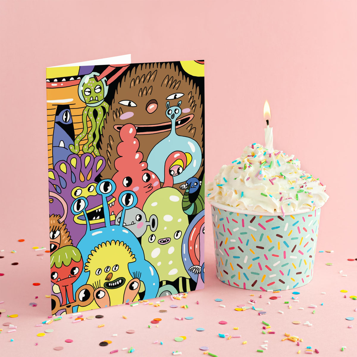 Set of 24 notecards with a graphic, full-coverage cartoon monster design in bold, saturated colors.