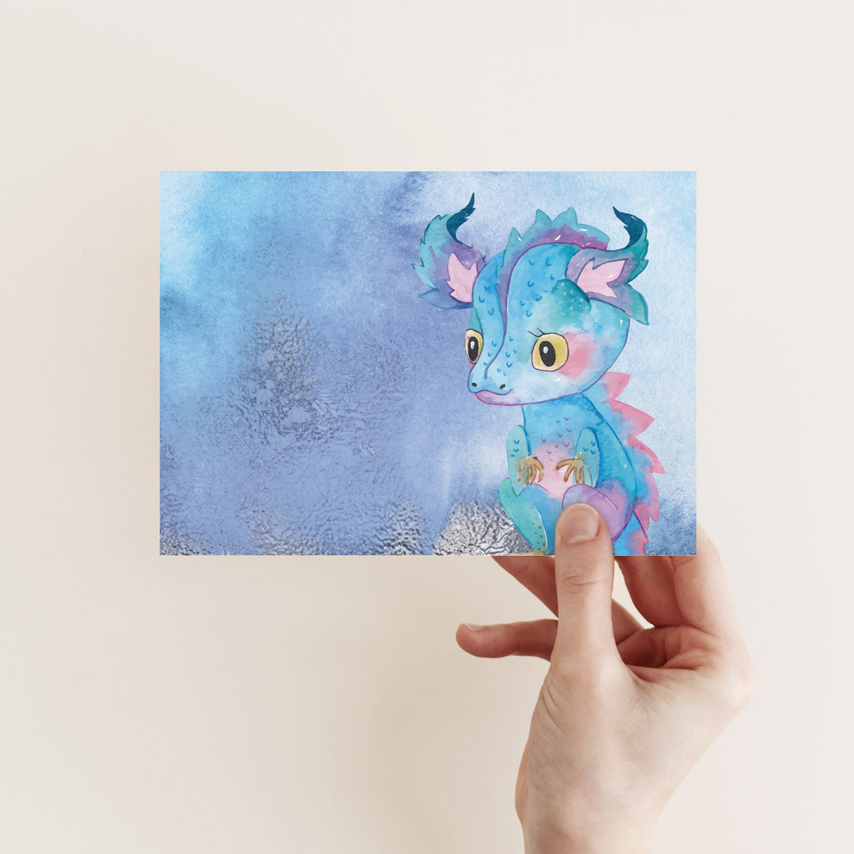 Set of 24 blank folded cards with whimsical dragon character illustrations rendered in watercolor-style mixed hues.