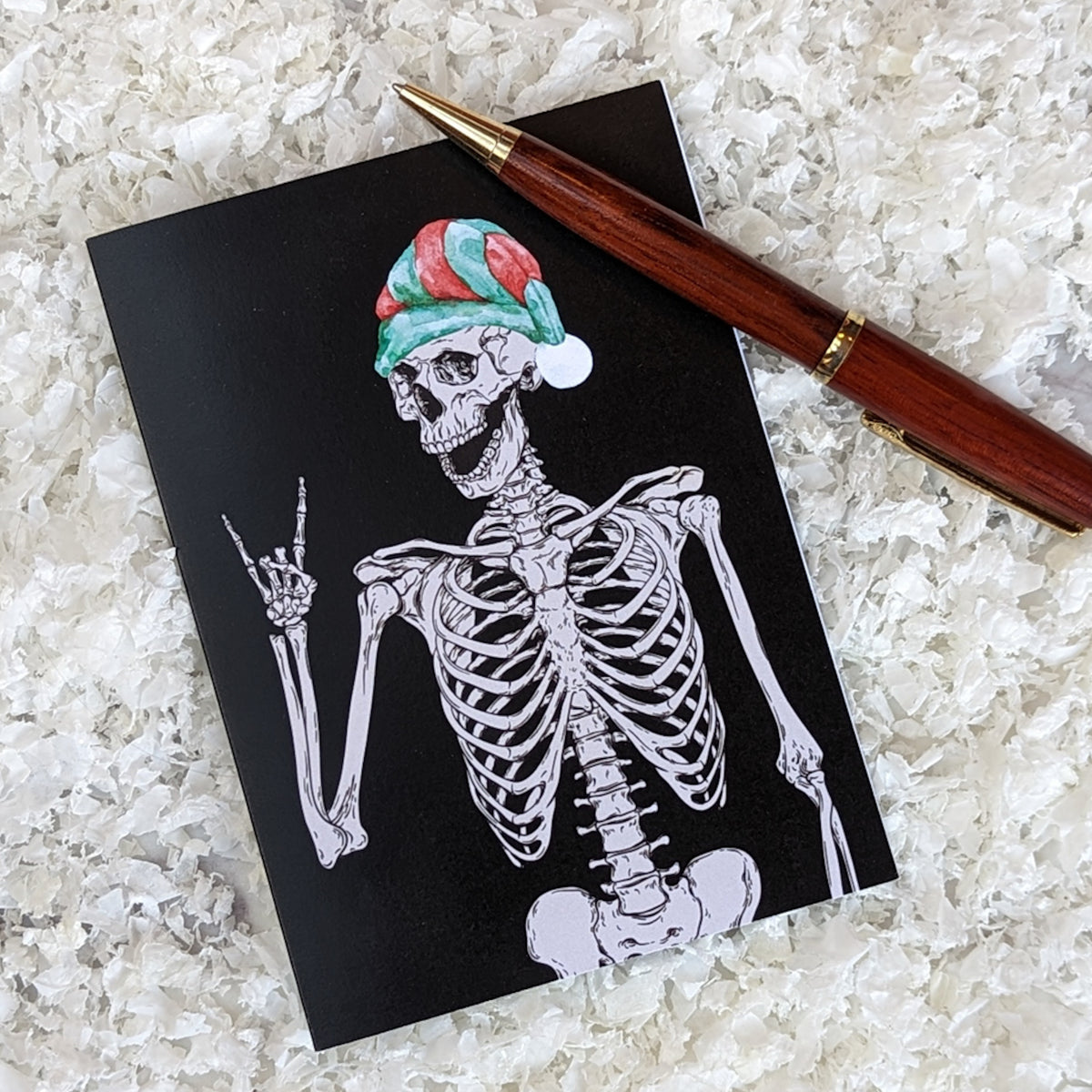 24-count Christmas card set, four skeleton designs with red, green, and white holiday accessories.