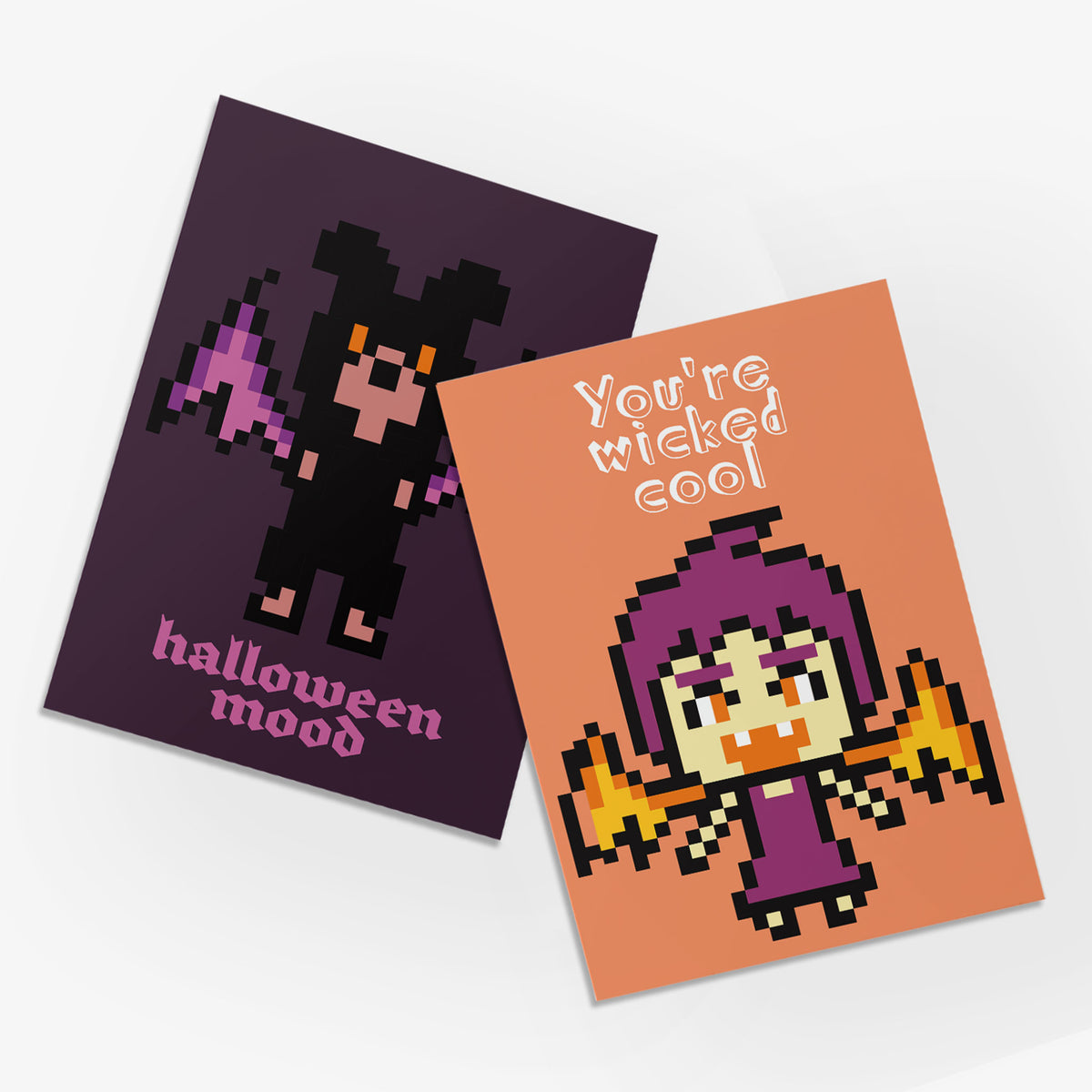 Pixel-style Halloween cards with blocky typography and single monster character centered on each design.