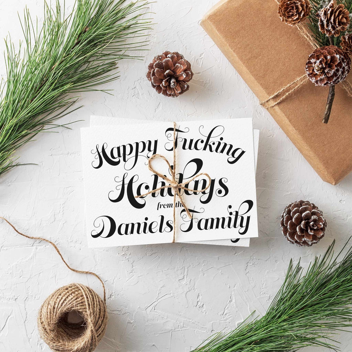 "Happy Fucking Holidays from the [Surname] Family" in centered black script, no border, landscape card orientation.