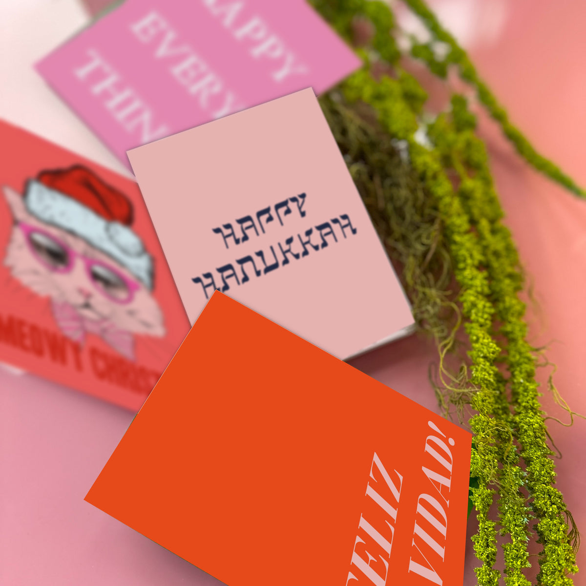 Count holiday card box with 12 designs in hot pink, magenta, coral, and brown with white, yellow, and navy type accents.