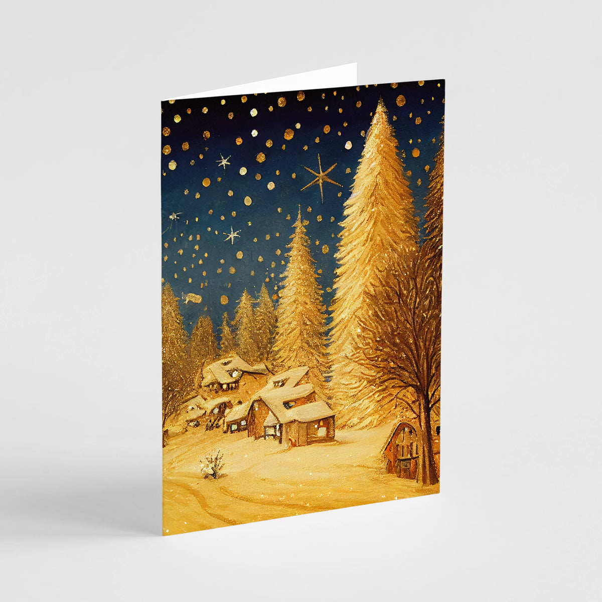 Christmas card set with four illustrated designs featuring gold trees and snow-covered scenes.