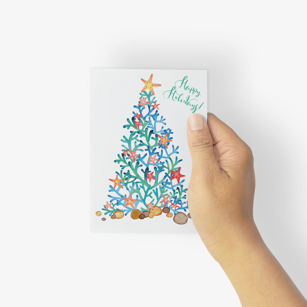 Coastal Christmas card set of 24 featuring starfish-decorated coral branch tree on white background.