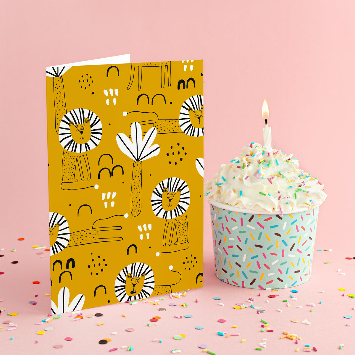 Cards with a flat allover repeat pattern of lions and stylized tropical leaves on a mustard yellow field.