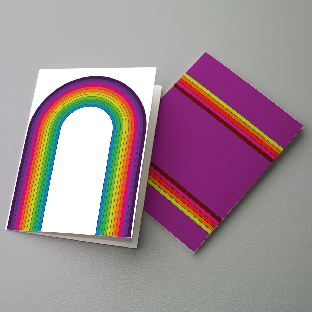 Flat graphic cards with tightly banded concentric arcs and parallel stripe groupings in retro rainbow palette.