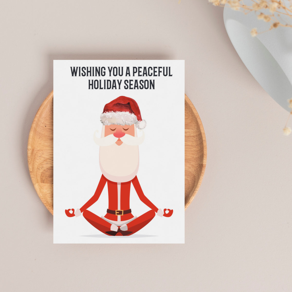 Illustrated Santa with white beard, red hat, and raised mudra hand on a set of 24 holiday cards.