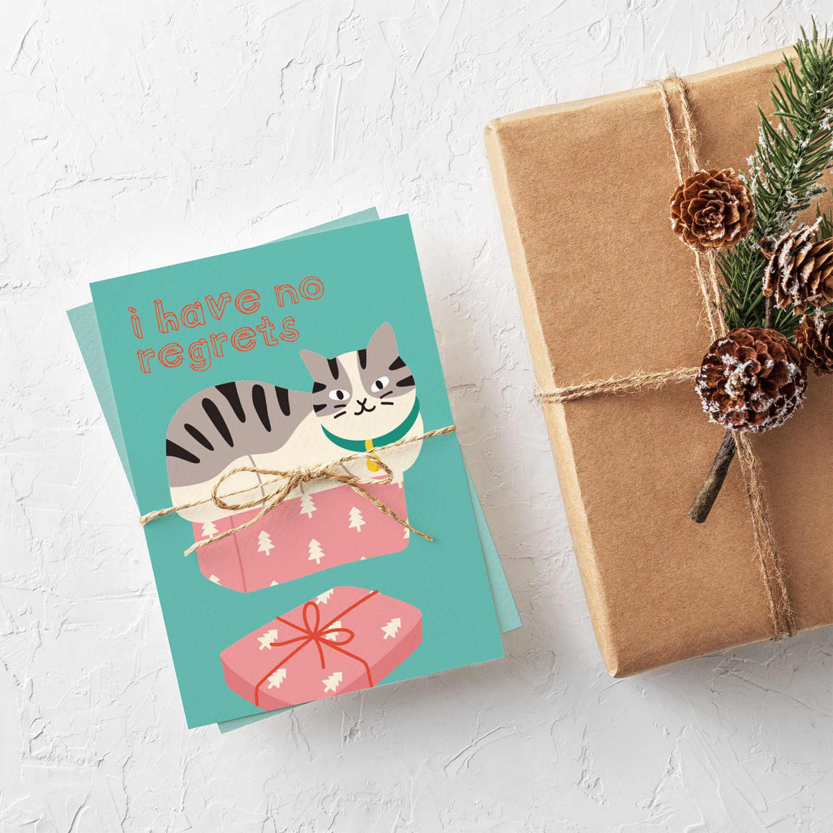 Christmas card assortment with illustrated cats and text in bold sans-serif and script lettering.